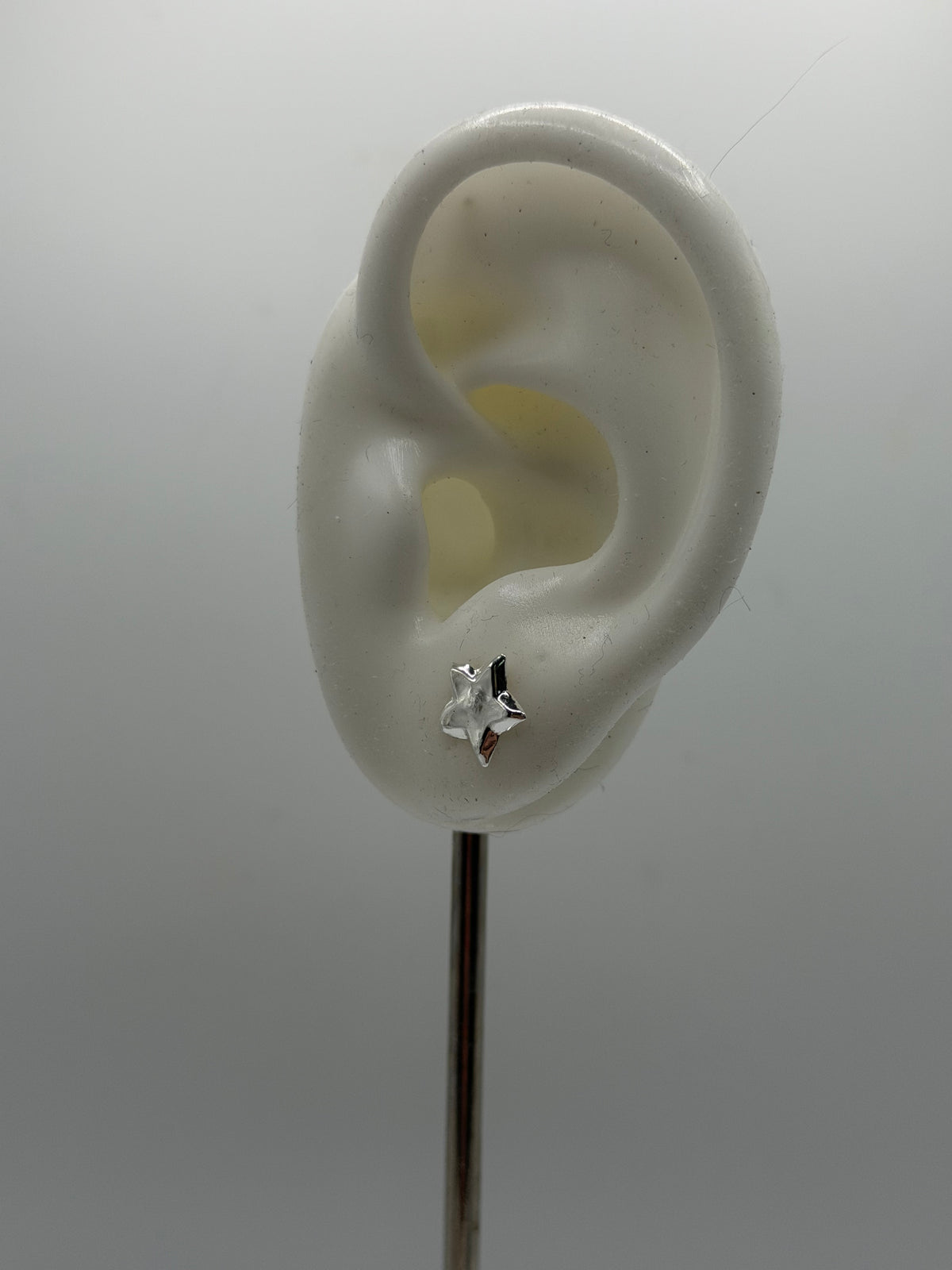 Pair of maxi star stud earrings handcrafted from recycled 925 sterling silver by Wild One Jewellery.