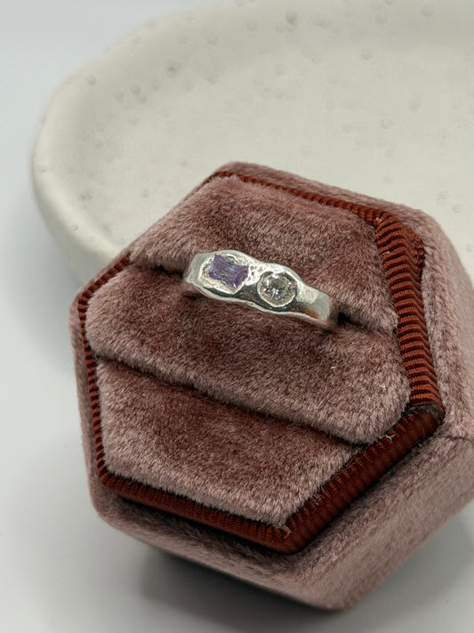 One-of-a-kind 999 fine silver ring from the Stone + Silver collection, featuring lavender-coloured and clear cubic zirconia gemstones set in a handcrafted design.