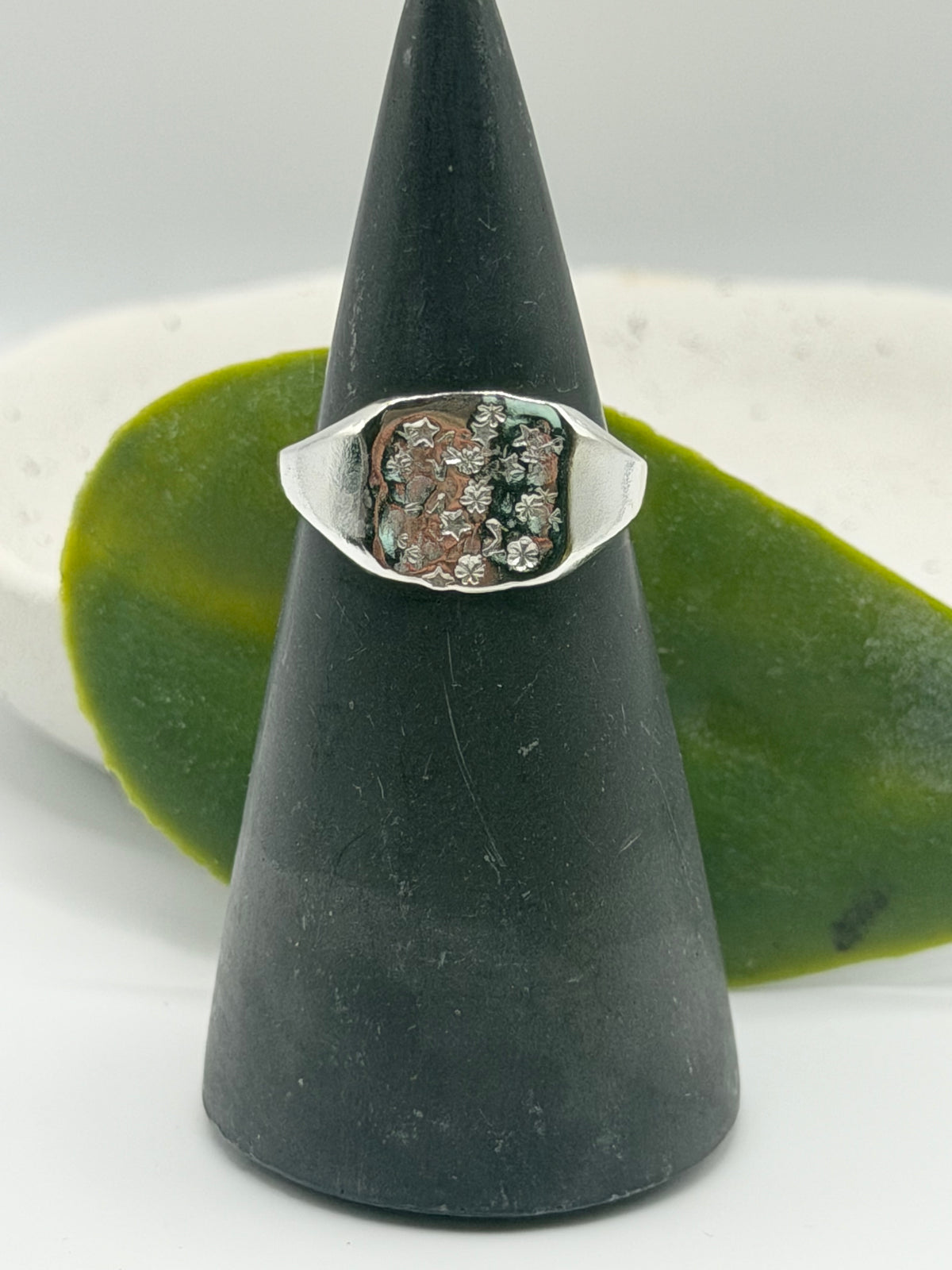 Handmade recycled sterling silver Galaxy Signet Ring featuring a circular dimple-textured face with tiny scattered star details, crafted in small batches by independent silversmith Wild One Jewellery in Lincolnshire, UK.
