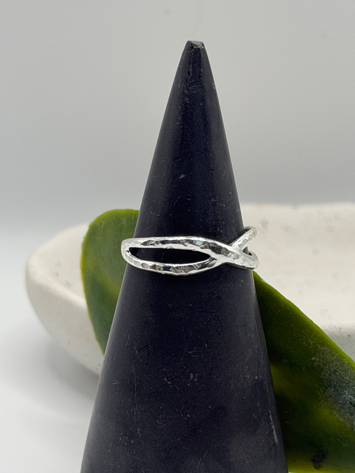 Handmade recycled sterling silver Twist Ring with an organic crossover design and contrasting hammered and linear textures, created in small batches by independent silversmith Wild One Jewellery in Lincolnshire, UK.