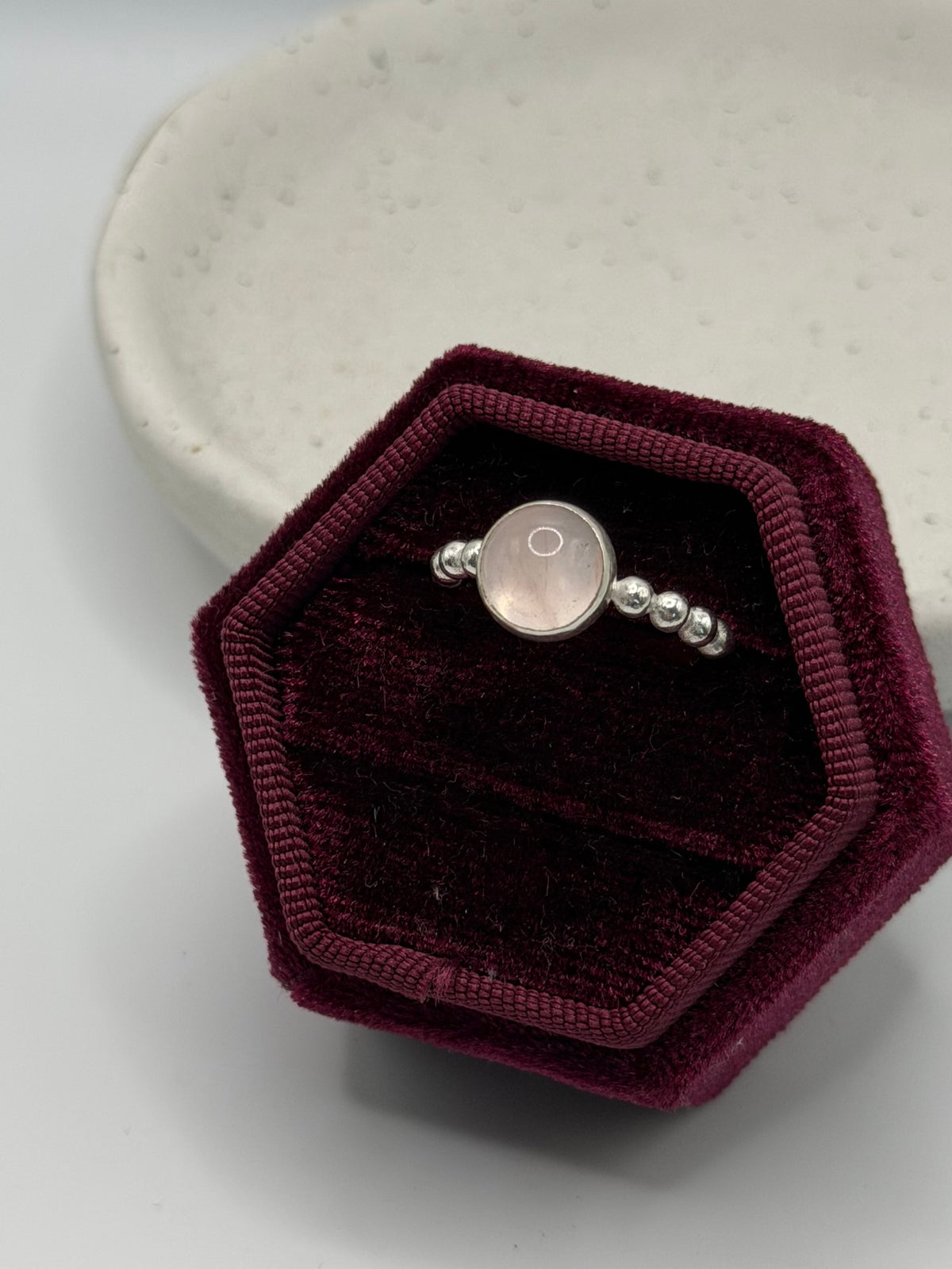 One-of-a-kind round rose quartz bobble ring from the Stone + Silver collection by Wild One Jewellery, featuring a pale pink rose quartz cabochon set in a sterling silver band with decorative silver bobble details.