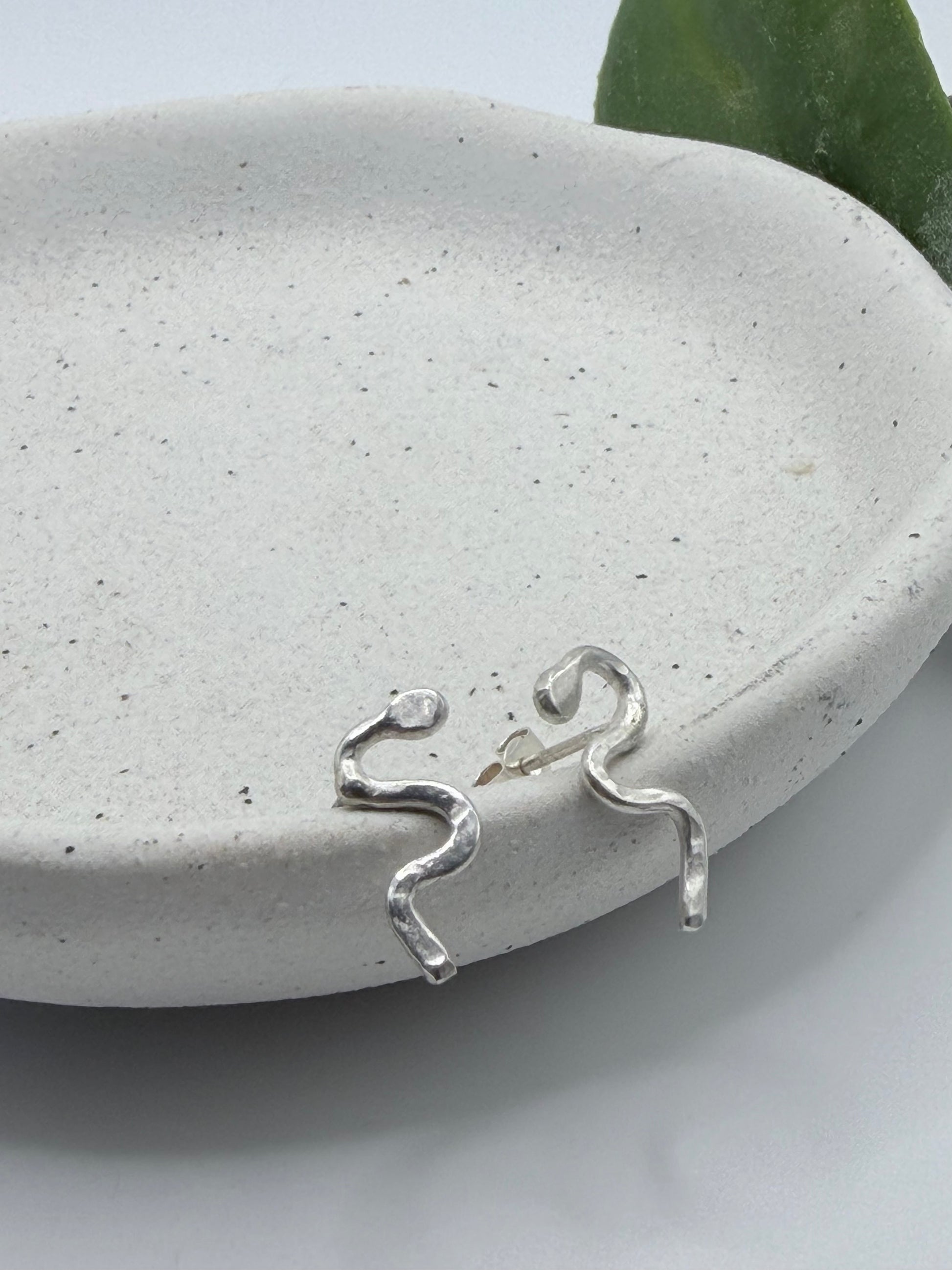 Handmade recycled sterling silver snake stud earrings by Wild One Jewellery, an independent silversmith based in Lincolnshire, UK, creating small-batch, nature-inspired jewellery.