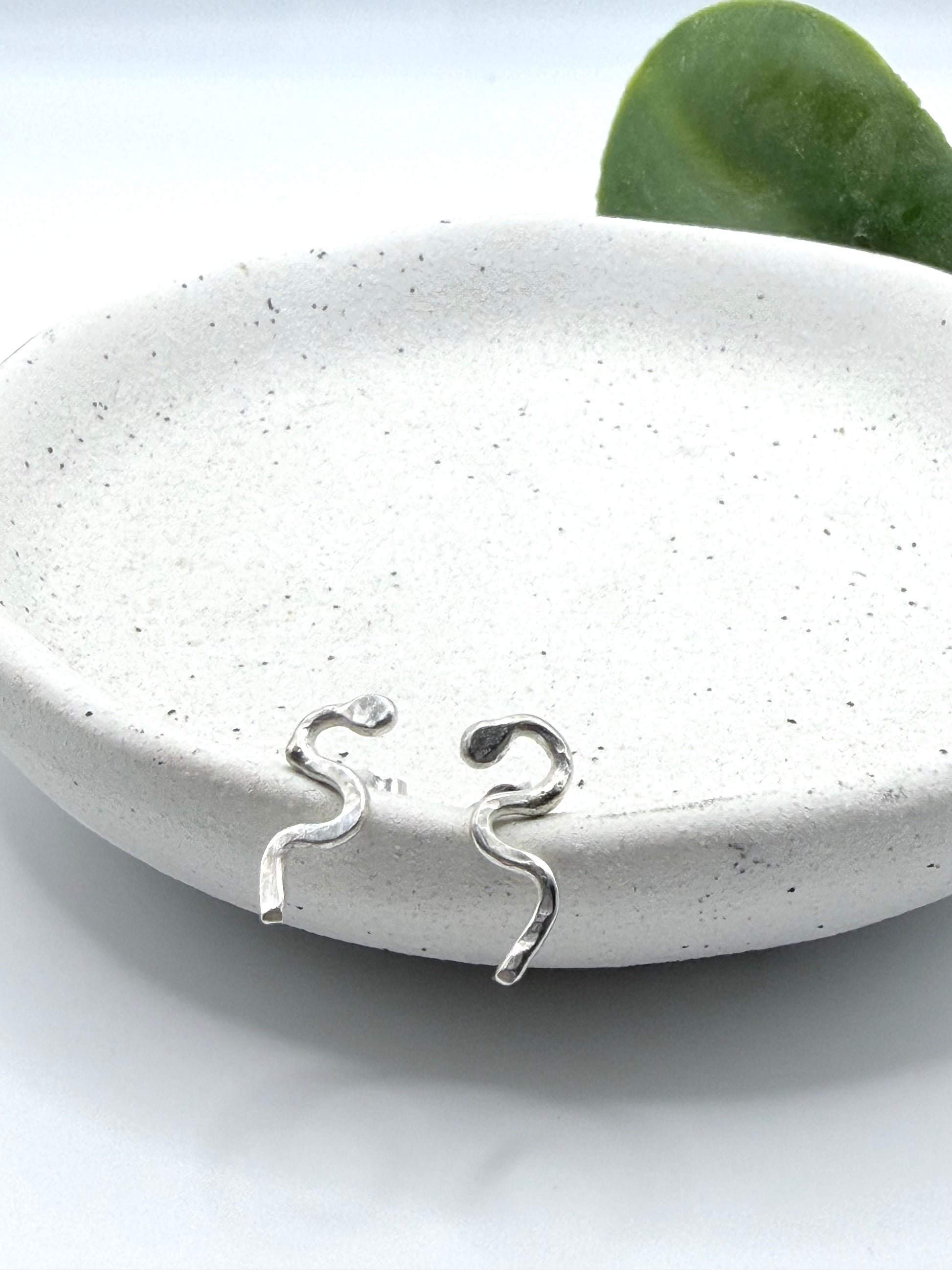 Handmade recycled sterling silver snake stud earrings by Wild One Jewellery, an independent silversmith based in Lincolnshire, UK, creating small-batch jewellery 