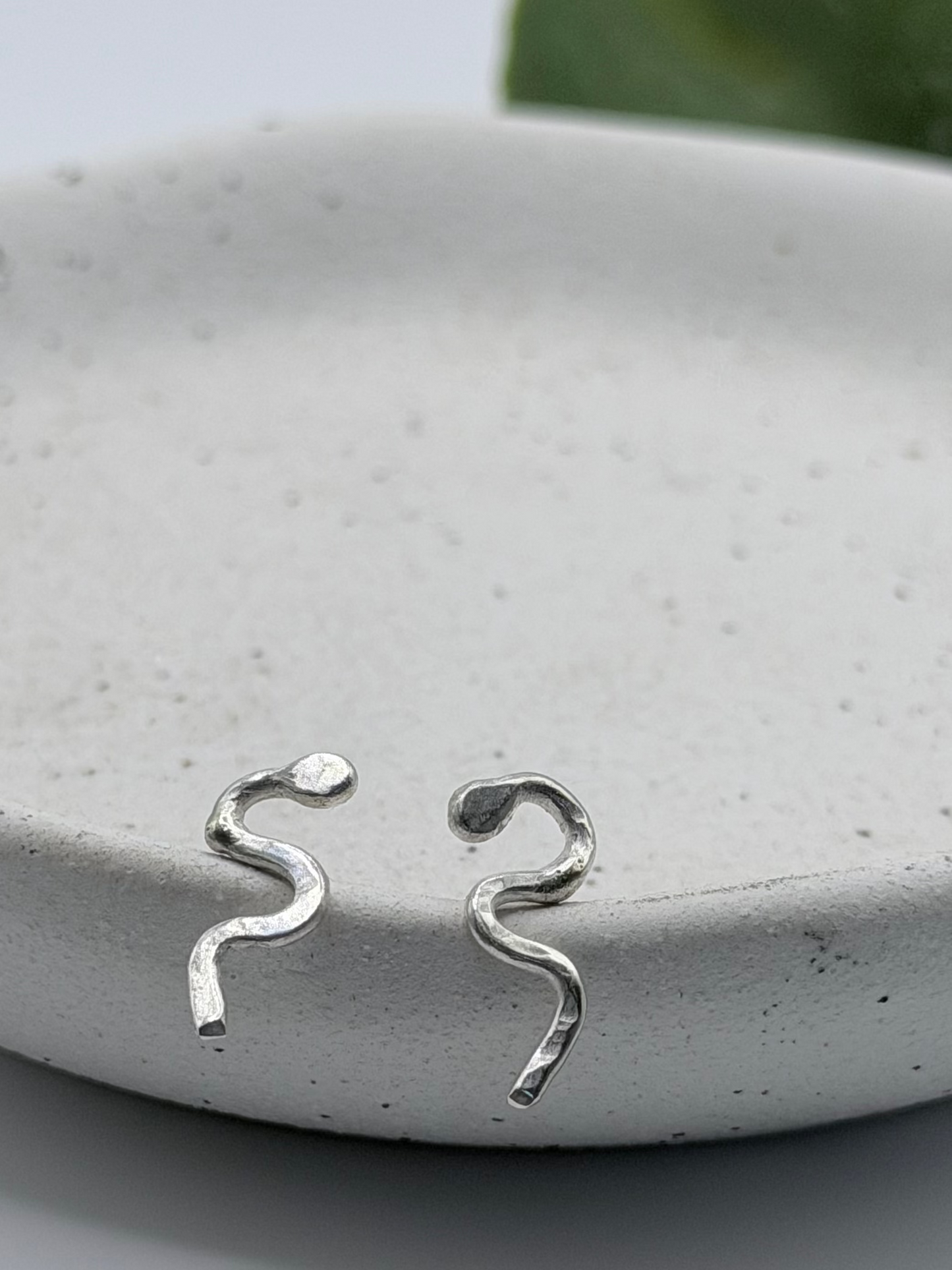 Handmade recycled sterling silver snake stud earrings by Wild One Jewellery, an independent silversmith based in Lincolnshire, UK, creating small-batch, nature-inspired jewellery.