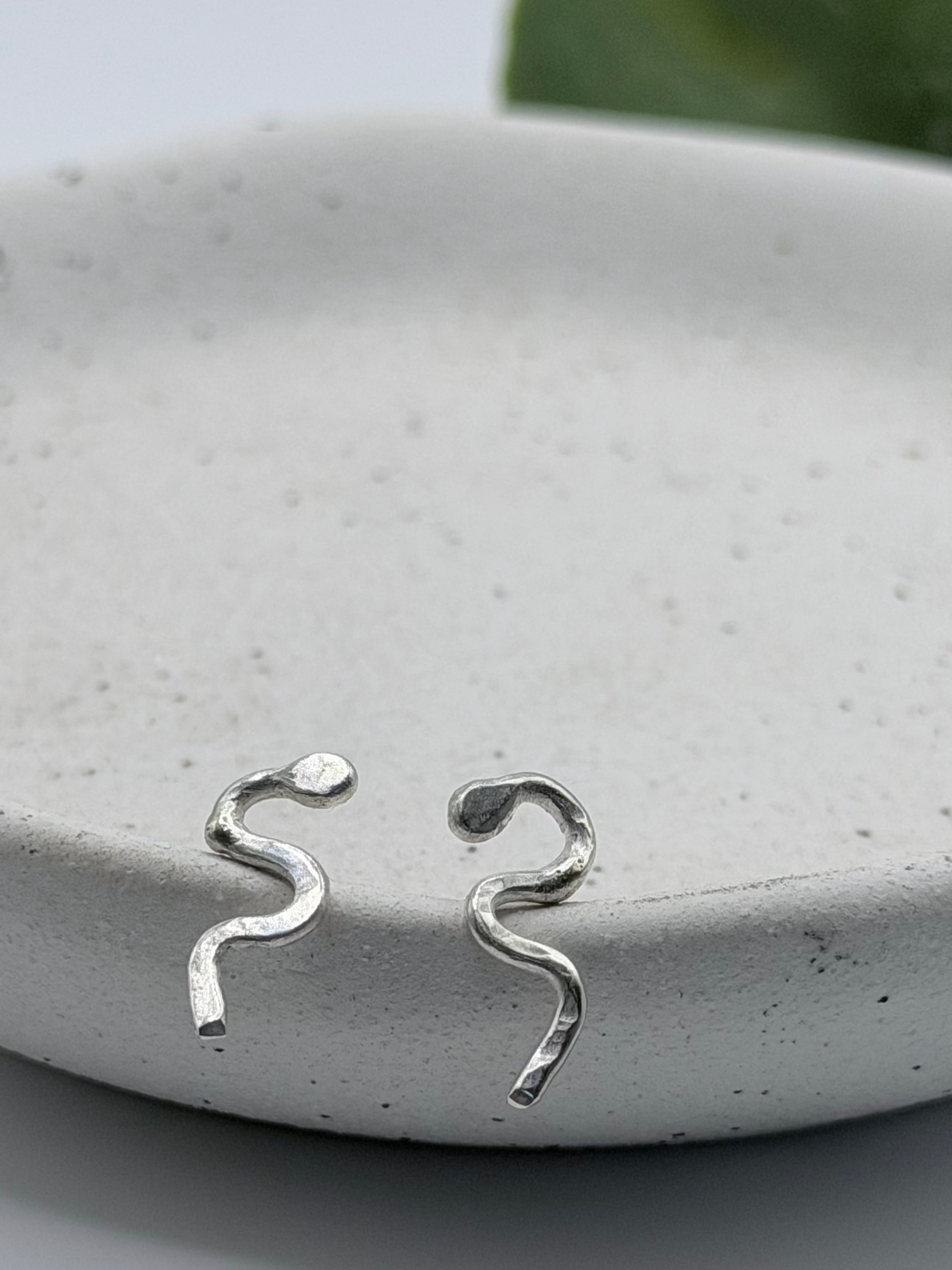 Handmade recycled sterling silver snake stud earrings by Wild One Jewellery, an independent silversmith based in Lincolnshire, UK, creating small-batch, nature-inspired jewellery.