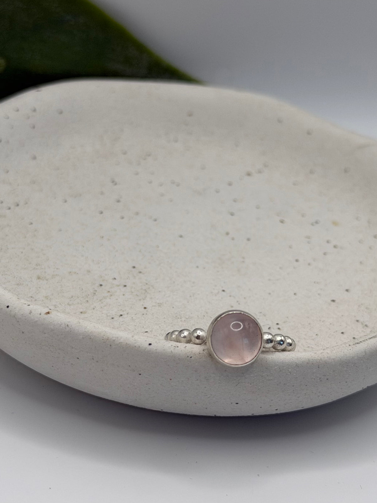 One-of-a-kind round rose quartz bobble ring from the Stone + Silver collection by Wild One Jewellery, featuring a pale pink rose quartz cabochon set in a sterling silver band with decorative silver bobble details.