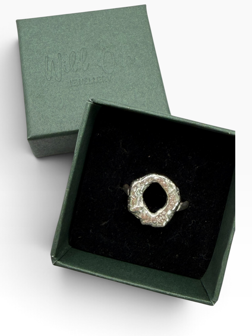 Handmade chunky Molten Circle ring crafted from recycled sterling silver, with an irregular lava-like texture created by melting the silver and quenching it in water to freeze its organic shape. Wild One Jewellery.