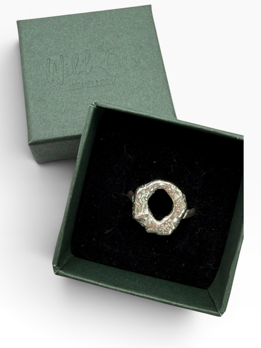 Handmade chunky Molten Circle ring crafted from recycled sterling silver, with an irregular lava-like texture created by melting the silver and quenching it in water to freeze its organic shape. Wild One Jewellery.