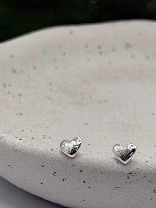 Pair of Love Studs handcrafted from recycled 925 sterling silver with a softly textured heart design.