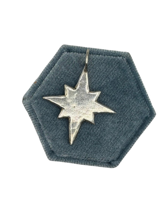 Handmade maxi pole star charm crafted from 999 fine silver metal clay by Wild One Jewellery, featuring an organic shape and textured celestial detailing.