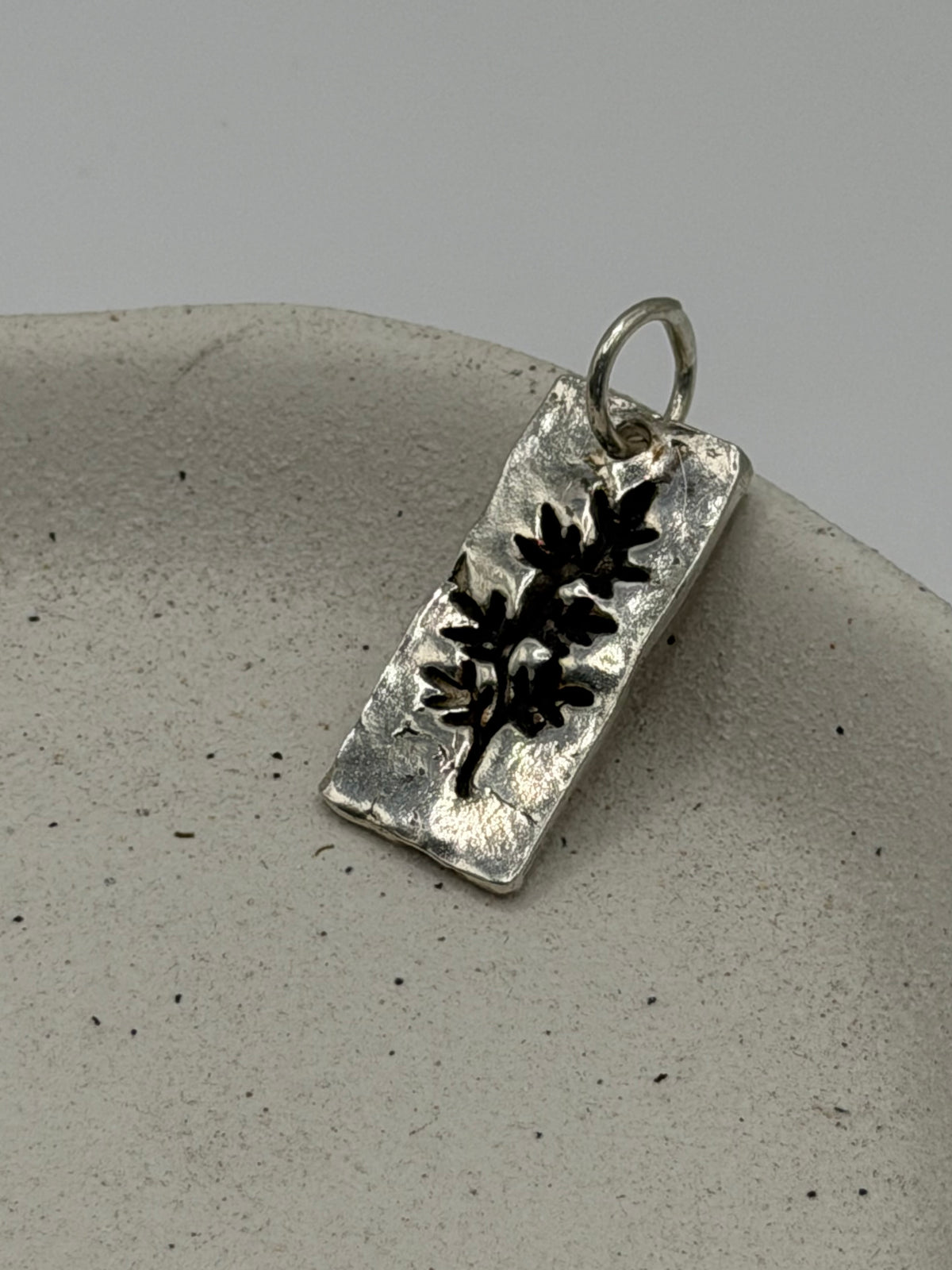 Handmade fine silver Midi Leaf charm with an organic, textured leaf design, available with a belcher chain from Wild One Jewellery\.