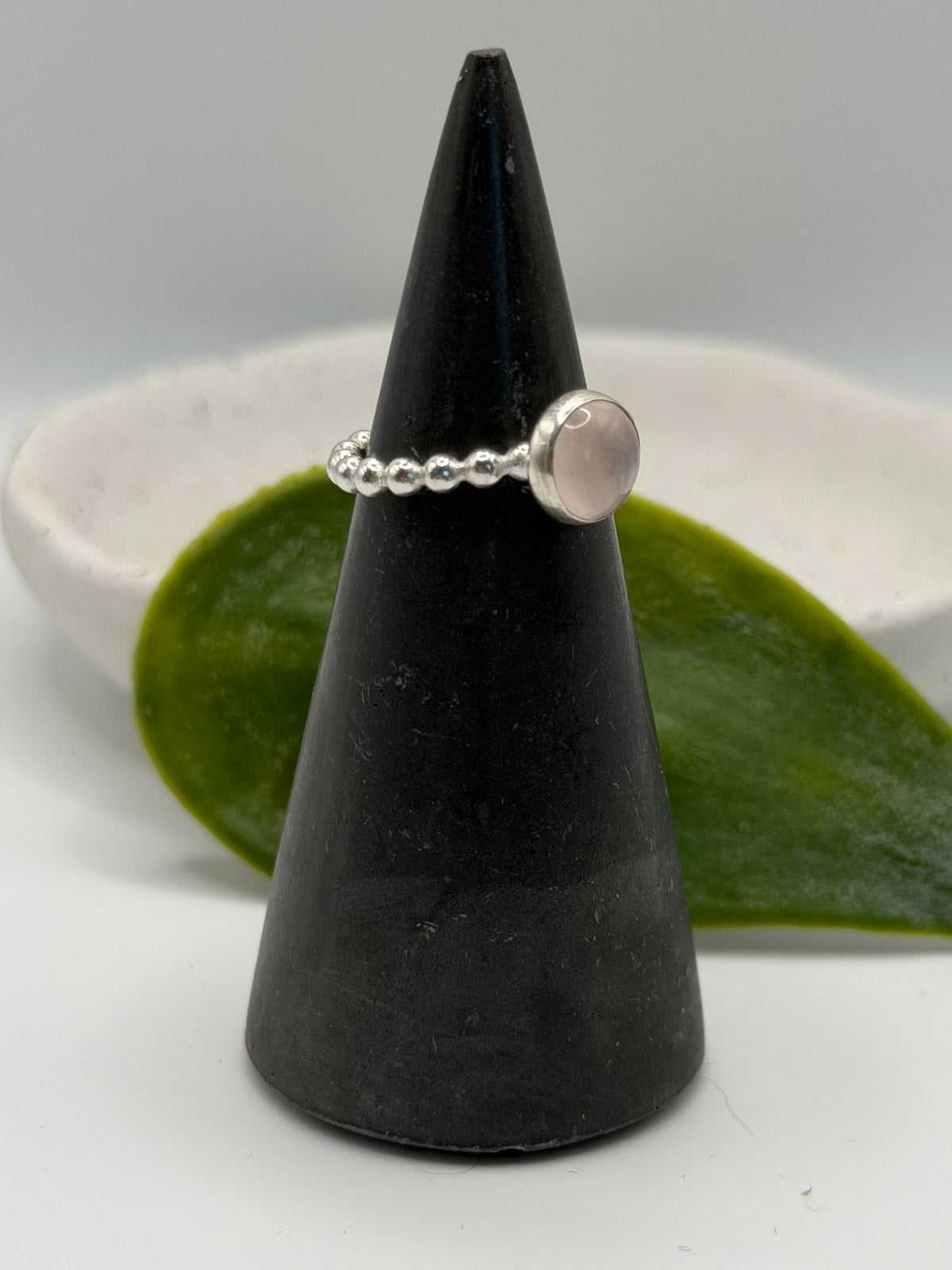 One-of-a-kind round rose quartz bobble ring from the Stone + Silver collection by Wild One Jewellery, featuring a pale pink rose quartz cabochon set in a sterling silver band with decorative silver bobble details.