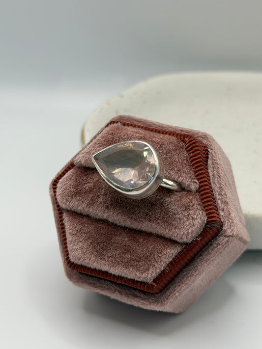 Image alt text: One-of-a-kind statement rose quartz ring from the Stone + Silver collection, featuring a large faceted blush-pink gemstone set in a sterling silver band.