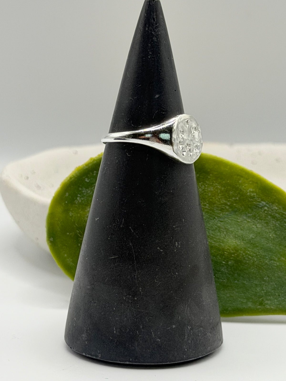 Handmade recycled sterling silver Galaxy Signet Ring featuring a circular dimple-textured face with tiny scattered star details, crafted in small batches by independent silversmith Wild One Jewellery in Lincolnshire, UK.