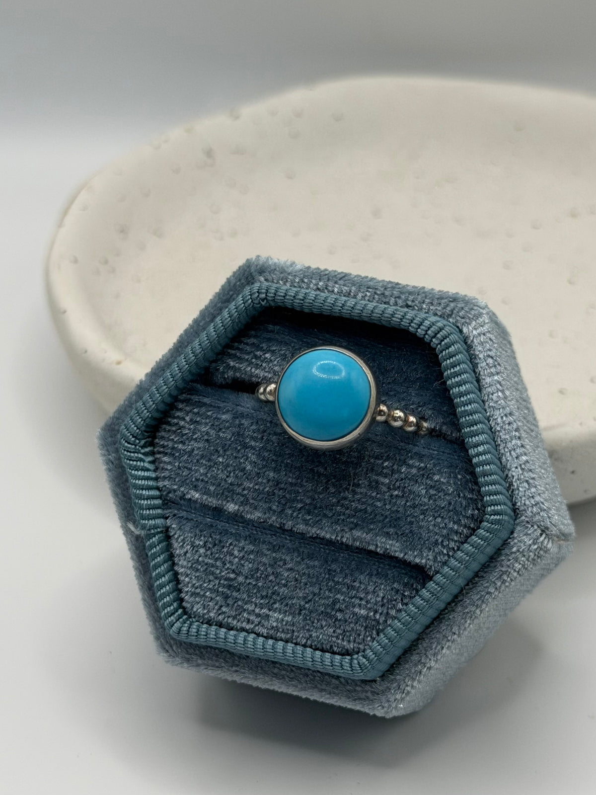 One-of-a-kind turquoise bobble ring from the Stone + Silver collection by Wild One Jewellery, featuring a turquoise cabochon set in a sterling silver band with decorative silver bobble details.